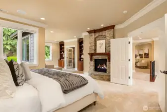 Private and luxurious Primary Suite with double door entry and cozy gas fireplace