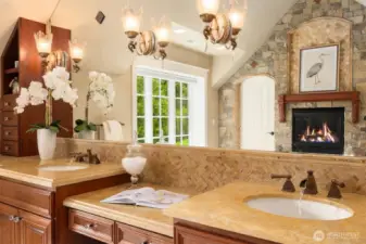 Dual vanities with makeup desk, stone accent wall with gas fireplace