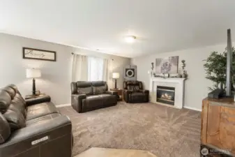 Stay connected with your guests in the open family room with cozy gas fireplace.