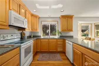 Spacious kitchen faces west towards the backyard and golf course.
