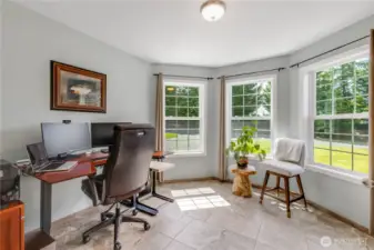Office/Flex Room on Main floor has views of the front yard and features heated floors