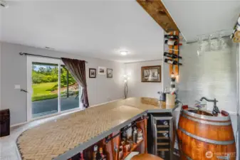 One of a kind bar top will delight guests while there is ample storage below.