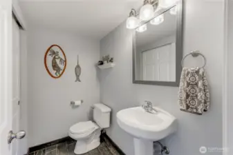 1/2 bath on Lower Level with tile floors & trim