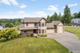 Looking for some room to spread out? The corner lot home sits on a bit of 1 acre, has a 2 car garage, RV Garage and abundant parking.