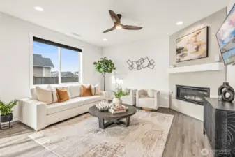 Open living room with fireplace.