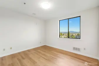 Primary bedroom with closet to the left side. Closet contains water heater.