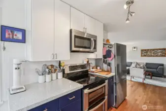Updated kitchen including quartz countertops and stainless appliances