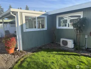 Exterior wall shows the compressor  for the ductless mini splitter.