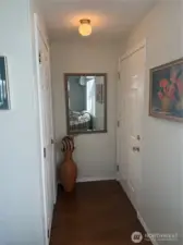 Front entry faces the coat closet and leads to the living room.