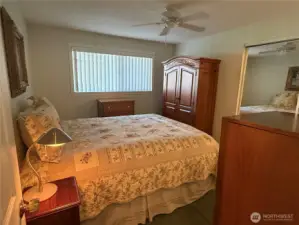 Primary bedroom and 3/4 bath at the end of the closet.