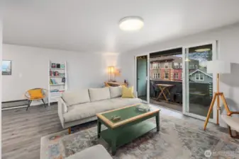 Living room with sliding door access to large deck