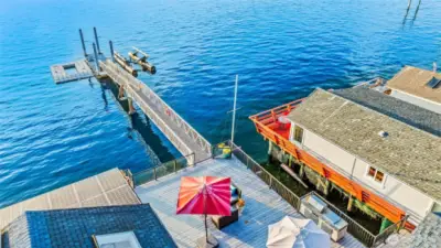 Bird’s-eye perspective of the dock and deck, showcasing your private connection to the Sound.