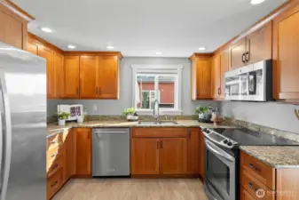 Practical kitchen in the third abode, with plenty of storage and workspace.