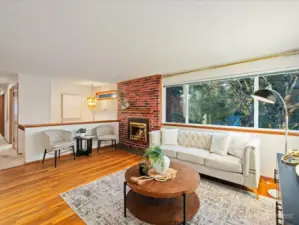 Large west facing windows, hardwood floors and a cozy gas fireplace make the living room a special space in the house