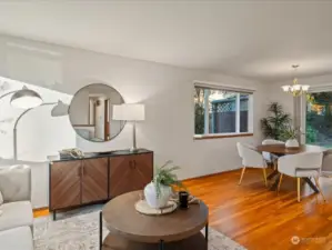 The living room and dining room open up to each other for great flow and windows allow in light on all sides