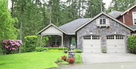 Elegant townhome in quiet wooded setting.