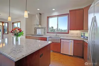 LARGE island, quartz countertops, and eating space