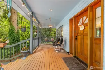 Lovely covered front porch is a perfect sitting place