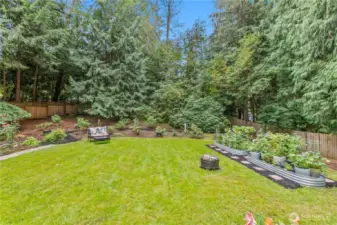 Flat, fully fenced backyard is very private