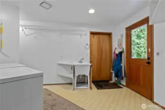 Laundry/mud room with utility sink, outdoor and garage access