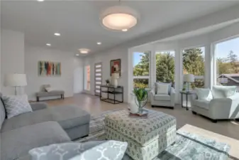 Unit B living room angle looking toward the entry & bow window design.