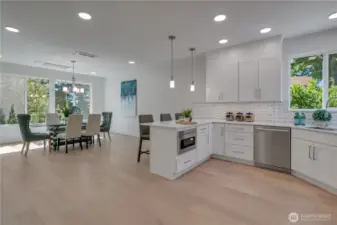 Unit B view of open main floor kichen & dining space.