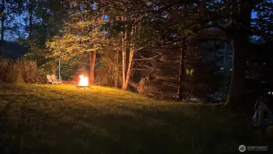 Seller provided photo enjoying a quiet evening around the fire pit in this secluded yard.