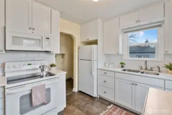Access to mudroom, laundry and backyard off kitchen