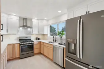 Bright Kitchen with Stainless Steel Appliances
