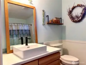 Nicely updated bathroom with beach decor