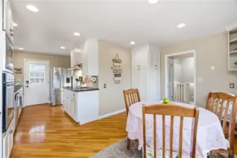 Eat-in kitchen, built-in office desk & door for patio access.