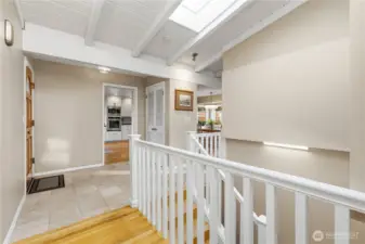 Vaulted entry foyer w/skylights and lower level access.