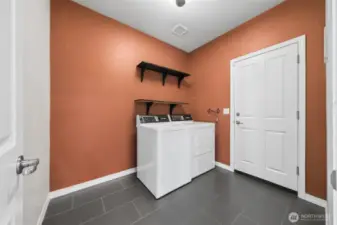 Large laundry room with door to garage