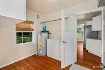 Utility room right off the kitchen with exit/entrance off the backyard