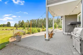 Patio off kitchen wraps around to front of home