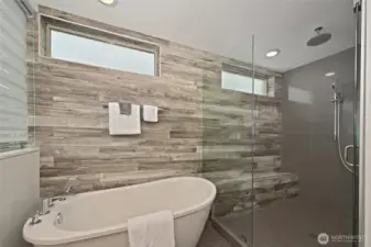 Separate soaking tub and oversized shower.