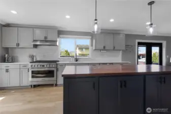 Luxurious Chefs Kitchen with an entertainers dream of a large island with power.