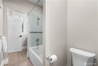 A spacious and beautifully appointed full bath, perfect for family or guests.