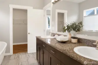 Primary bath with a large walk-in closet.