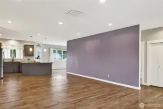 Open floor plan and the hallway to the two bedrooms and a hall full bath is separate from the primary located on the other side of the home. Front entry closet.