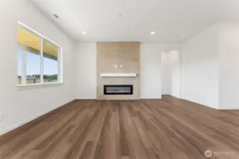 Great room tile is from floor to ceiling fireplace