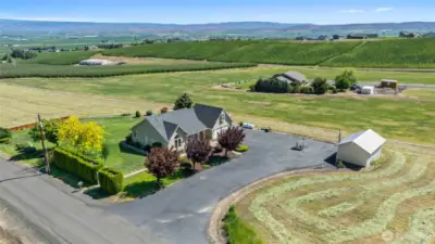 Surounded by ag ground, this home is perched to perfectly take in the views from all directions!