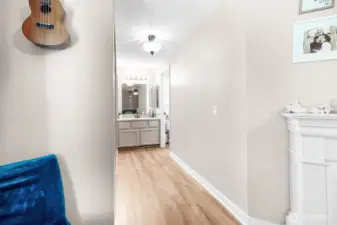 Hall area to Primary full bath and closets.