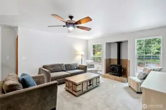 Large living room opens to a formal dining room and the primary bedroom suite