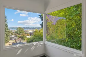 Oversized windows flood the room with daylight and views.