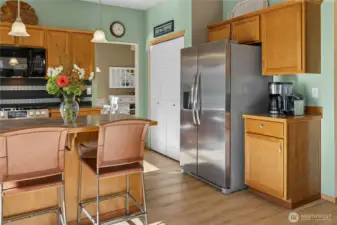 Open kitchen with newer appliances and large pantry