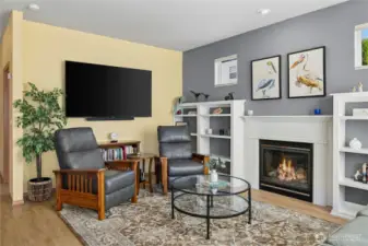 Great Room with cozy natural gas fireplace and built-in bookcases