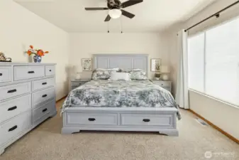 Large king size bed fits comfortably in the 14' x 14' ensuite bedroom
