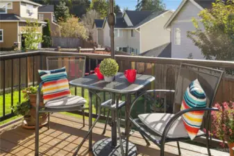 Sunny deck with low-maintenance railings and composite decking has room for table and grill