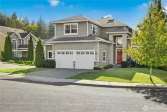Garage is oversized with room for two full sized vehicles and racks of storage